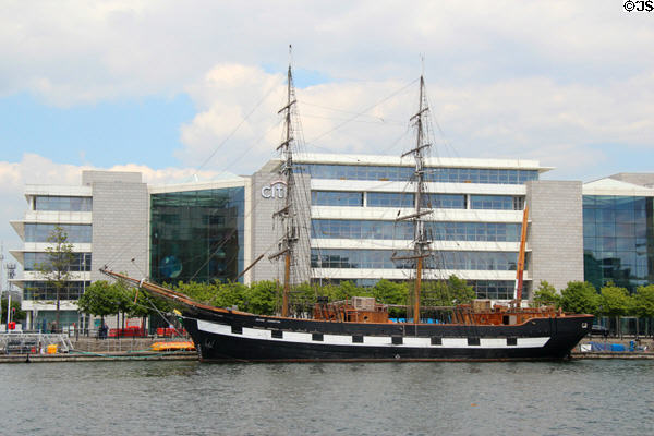 Jeanie Johnstone Tall Ship docked in front of CITI building on River Liffey. Dublin, Ireland.