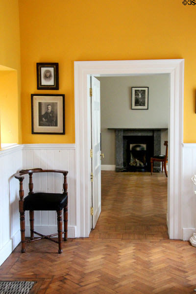 Entrance hall with corner chair at Derrynane House. Ireland.