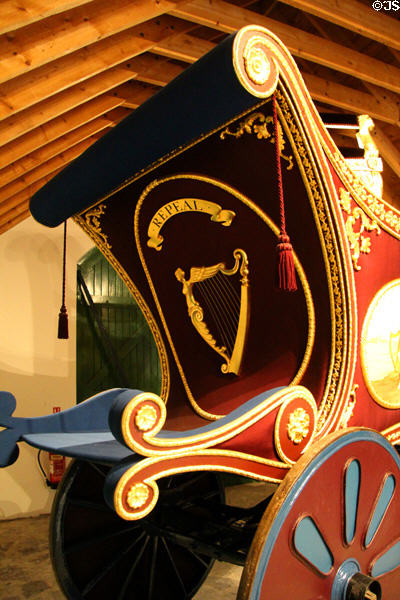 Detail of Triumphal Chariot with Repeal banner & Irish harp representing campaign for repeal of Act of Union & Irish independence at Derrynane House. Ireland.