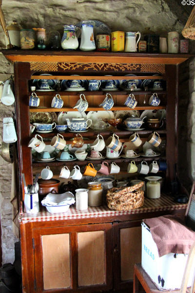 Cupboard holding family tableware at Foley's farm at Muckross Traditional Farms in Killarney National Park. Killarney, Ireland.