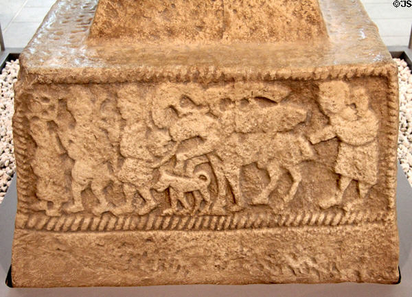Headless body of Goliath being taken to Jerusalem scene (800s) on plaster replica of north high cross from Ahenny in County Tipperary at Medieval Mile Museum. Kilkenny, Ireland.