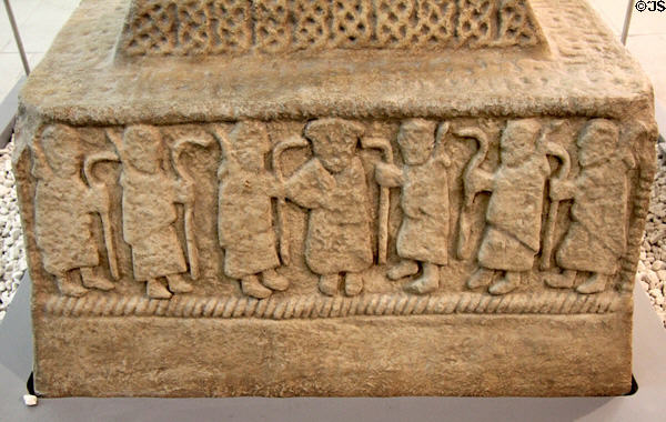 Christ sending out Apostles scene (800s) on plaster replica of north high cross from Ahenny in County Tipperary at Medieval Mile Museum. Kilkenny, Ireland.
