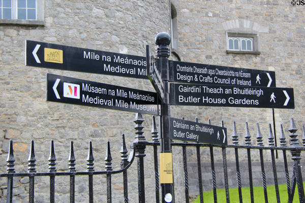 Bilingual directional signs. Kilkenny, Ireland.