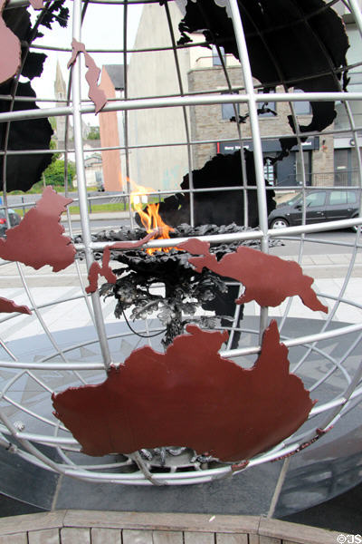 World globe with eternal flame at Dunbrody Famine Ship. New Ross, Ireland.