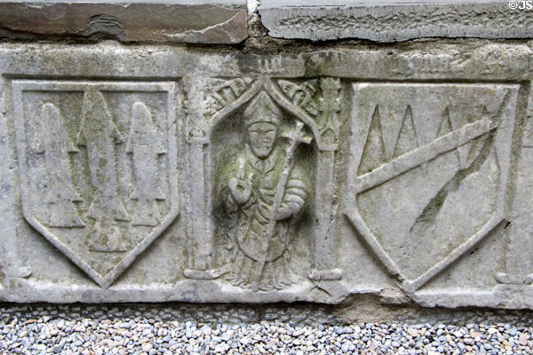 Stone tomb (16thC) carved with bishop & crests in cathedral at Rock of Cashel. Cashel, Ireland.