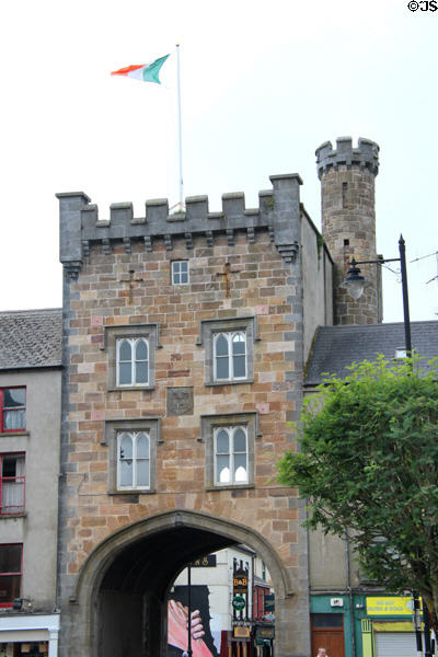 NeoGothic building (1831) with arch over O'Connell Street. Clonmel, Ireland.