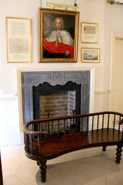Portrait of Charles Este, Bishop of Waterford, over upstairs landing fireplace & Irish bench at Bishop's Palace. Waterford, Ireland.