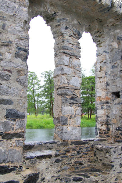 Stone window frame looking out onto Maigue River. Adare, Ireland.