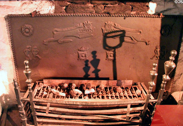 Fire back & grate in Main Guard at Bunratty Castle. County Clare, Ireland.