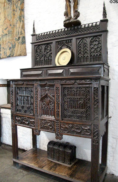 Ornate carved wooden cabinet in Great Hall at Bunratty Castle. County Clare, Ireland.