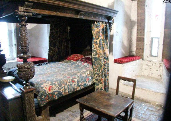 Canopy bed with carved bed posts & embroidered hangings in Earl's private apartments at Bunratty Castle. County Clare, Ireland.