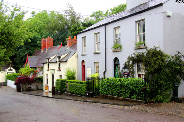Terraced houses built for workers, now housing small businesses at Bunratty Castle & Folk Park. County Clare, Ireland.
