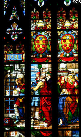 Carrying image of Christ in stained-glass of Duomo. Milan, Italy.