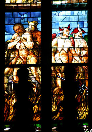 Devils in stained-glass of Duomo. Milan, Italy.