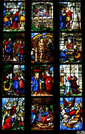 Scenes of stained-glass saints in Duomo. Milan, Italy.