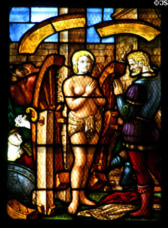 St Catherine with wheels in stained-glass in Duomo. Milan, Italy.