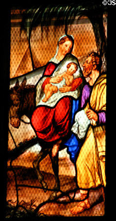 Flight into Egypt in stained-glass scene in Duomo. Milan, Italy.