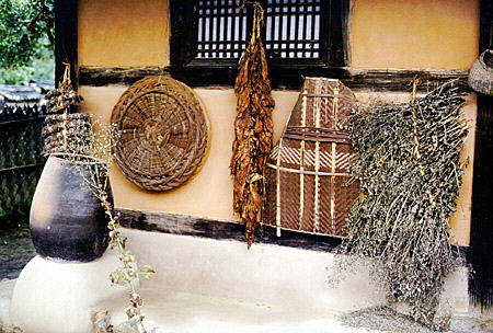 Variety of artifacts in folk village near Seoul which recreates Joseon town & folk life. South Korea.