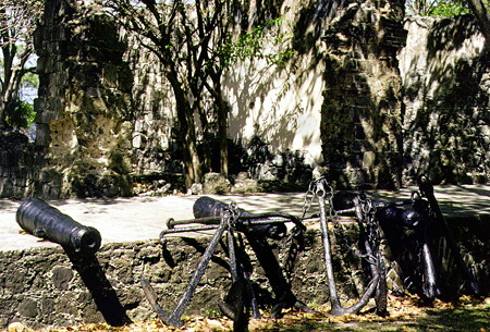 Ruins of the British officers quarters with canons and anchors in Pigeon Island National Park. St Lucia.