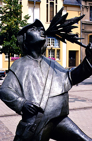 Statue of a fire breather in city of Luxembourg.