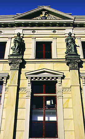 Statues guard a building on Rokin. Amsterdam, Netherlands.