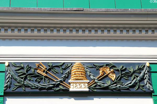 Ornately carved board (1822) above front door of prosperous home at Arnhem Openlucht Museum. Arnhem, Netherlands.