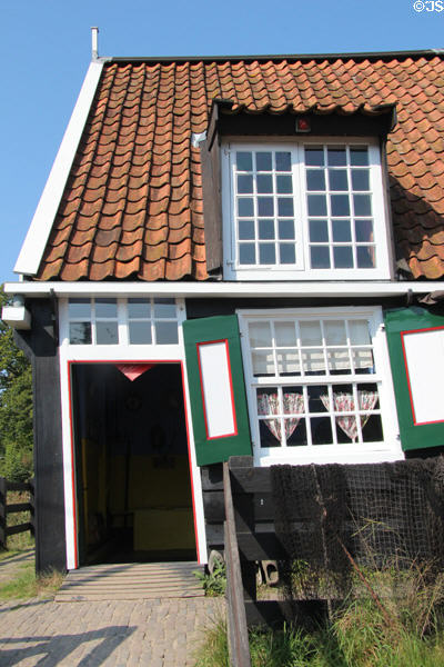 Fisherman's cottage (1807) from Marken which typically had an open fire in living room but no chimney, the smoke escaping through a hatch in the roof at Arnhem Openlucht Museum. Arnhem, Netherlands.