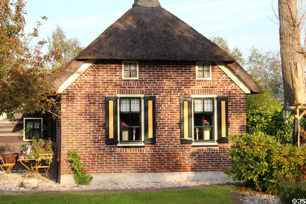 Side view of thatched roof home. Giethoorn, Netherlands.