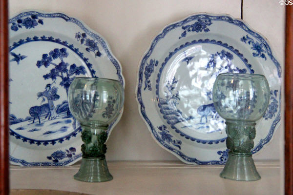 Blue & white Dutch style plates & green glass roemer in home of Pieter Teyler at Teylers Museum. Haarlem, Netherlands.