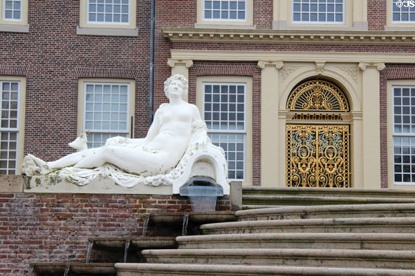 Garden gate in gilded wrought iron used to gain access to the terrace designed by D. Marot & neoclassical statue depicting a woman. Het Loo, Netherlands.