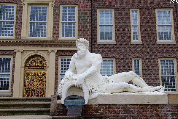 Garden gate in gilded wrought iron designed by D. Marot & male reclining statue possibly depicting a River God. Het Loo, Netherlands.