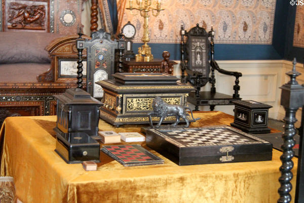 Board games & intricately carved furniture & other objects in King Willem dressing room. Het Loo, Netherlands.