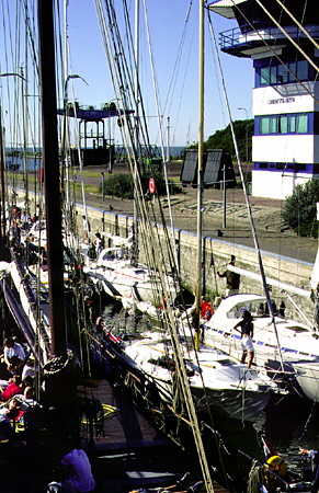 Boaters waiting in locks leading to sea in Afsluitdijk. Netherlands.