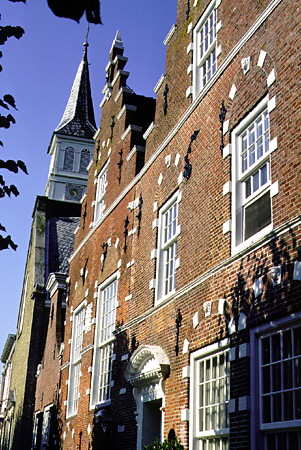 The buildings of a street on small canal. Sloten, Netherlands.