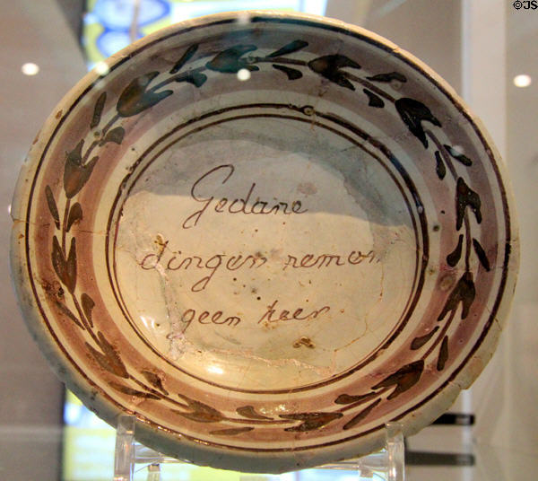 Stoneware dish with Dutch script in the center ANNO Stadsmuseum Zwolle. Zwolle, Netherlands.