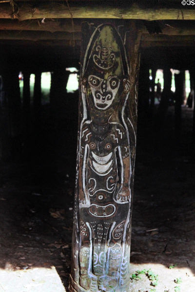 Carved post holding up the house Tambaran in Angoram. Papua New Guinea.