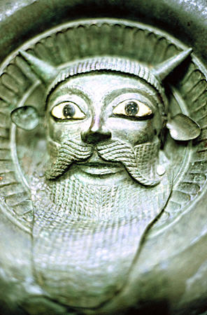 Bronze boss (mask) (late 6-5thC BCE) with Acheloos (later Greek river god with horns & unusual ears) from Tarquiala in Vatican Museum. Vatican City.