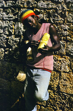 Kelvin Sandy carving bamboo vases at Fort James. Trinidad and Tobago.