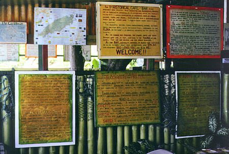 Some of the many history posters at First Historical Cafe on the windward coast of Tobago. Trinidad and Tobago.