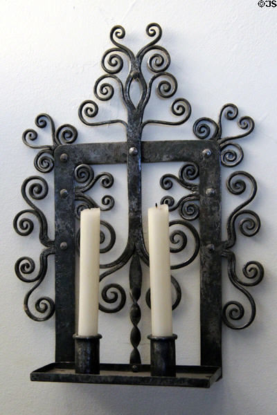 Wall-mounted wrought iron candle holder at Gladstone's Land tenement house. Edinburgh, Scotland.
