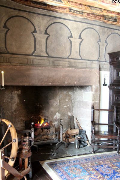 Fireplace with painted arches in painted chamber at Gladstone's Land tenement house. Edinburgh, Scotland.