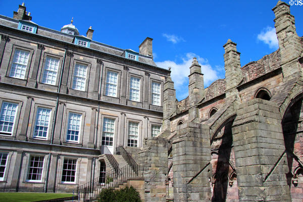 Flying buttresses of Holyrood Abbey behind Holyrood Palace. Edinburgh, Scotland.