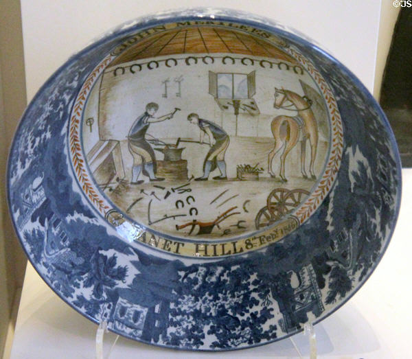 Earthenware punchbowl shows blacksmith scene to celebrate marriage of East Lothian smithy John Merylees to Janet Hill (c1815) at National Museum of Scotland. Edinburgh, Scotland.