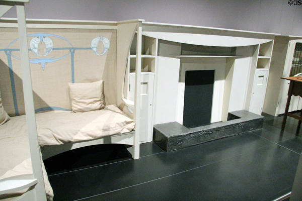 White fireplace with settle (1900) by Charles Rennie Mackintosh at National Museum of Scotland. Edinburgh, Scotland.