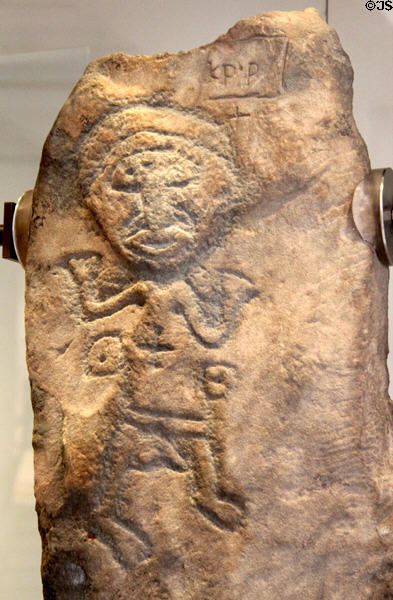 Scottish stone carving of Christian in prayer from Over Kirkhope at National Museum of Scotland. Edinburgh, Scotland.