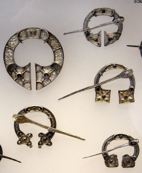 Silver brooches from St Ninian's Isle Treasure (c800-50) found in Shetland church prob. hidden from Vikings at National Museum of Scotland. Edinburgh, Scotland.