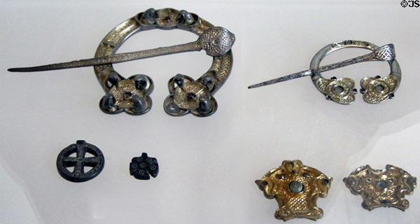 Silver brooches & Christian symbols found in Scotland at National Museum of Scotland. Edinburgh, Scotland.