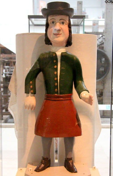 Carved wooden shop sign flax dresser (18thC) from Edinburgh at National Museum of Scotland. Edinburgh, Scotland.