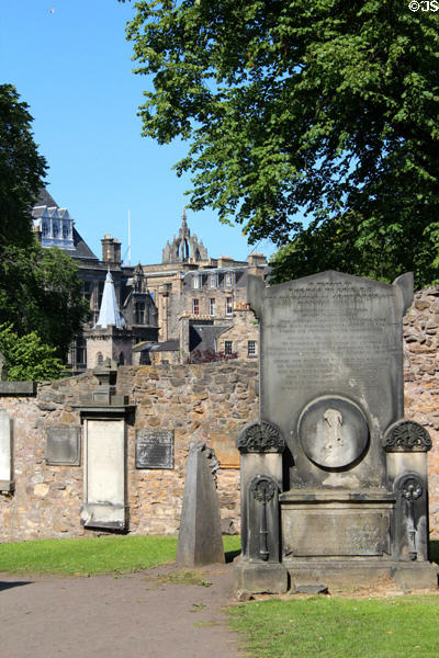 Monuments with dome of St Giles beyond wall at Greyfriars Kirk. Edinburgh, Scotland.