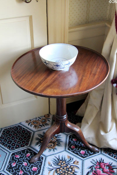 Small round table with porcelain bowl in bedchamber at Georgian House museum. Edinburgh, Scotland.